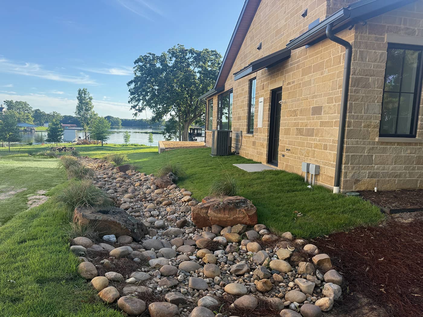Photo of a driveway with a drainage grate