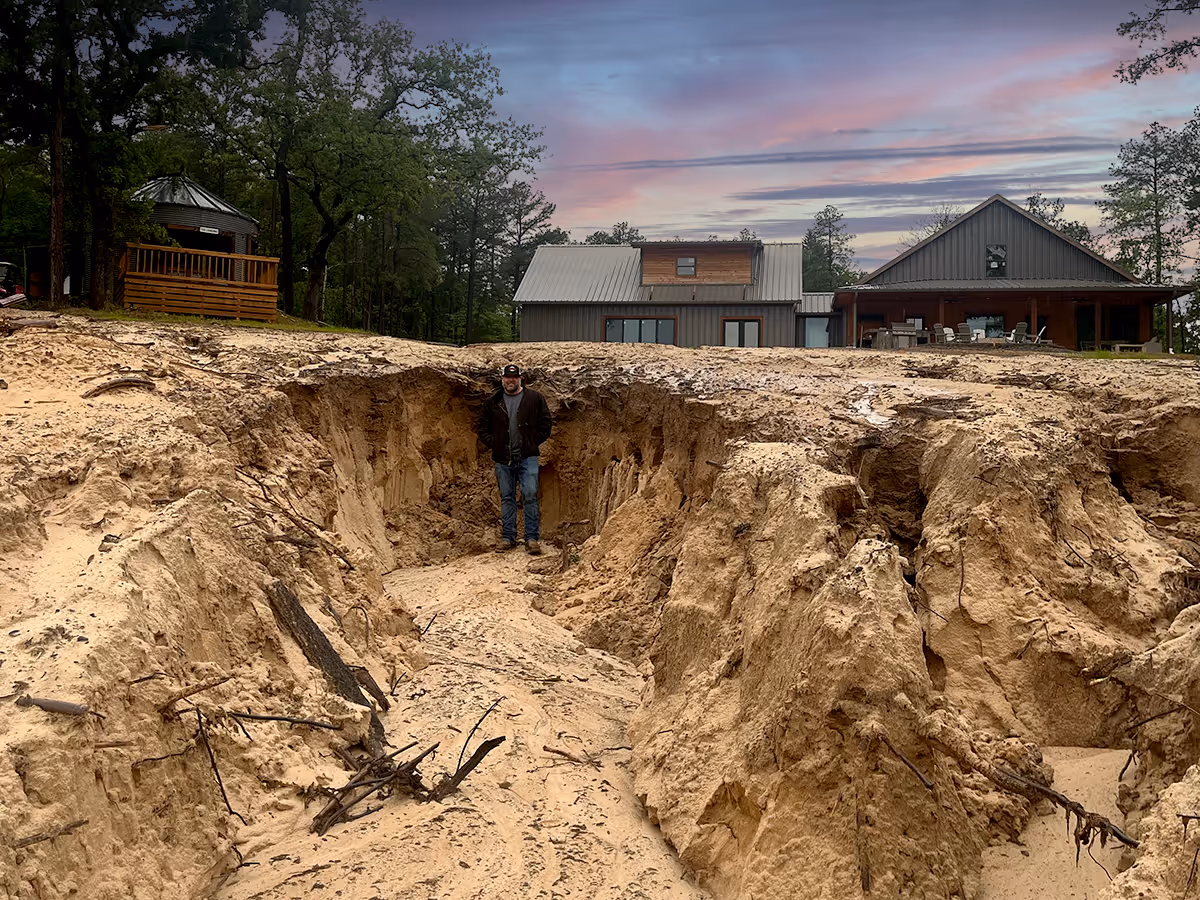 Photo of a beautiful stone walkway, stone stairs and rock retaining wall with landscaping surrounding it