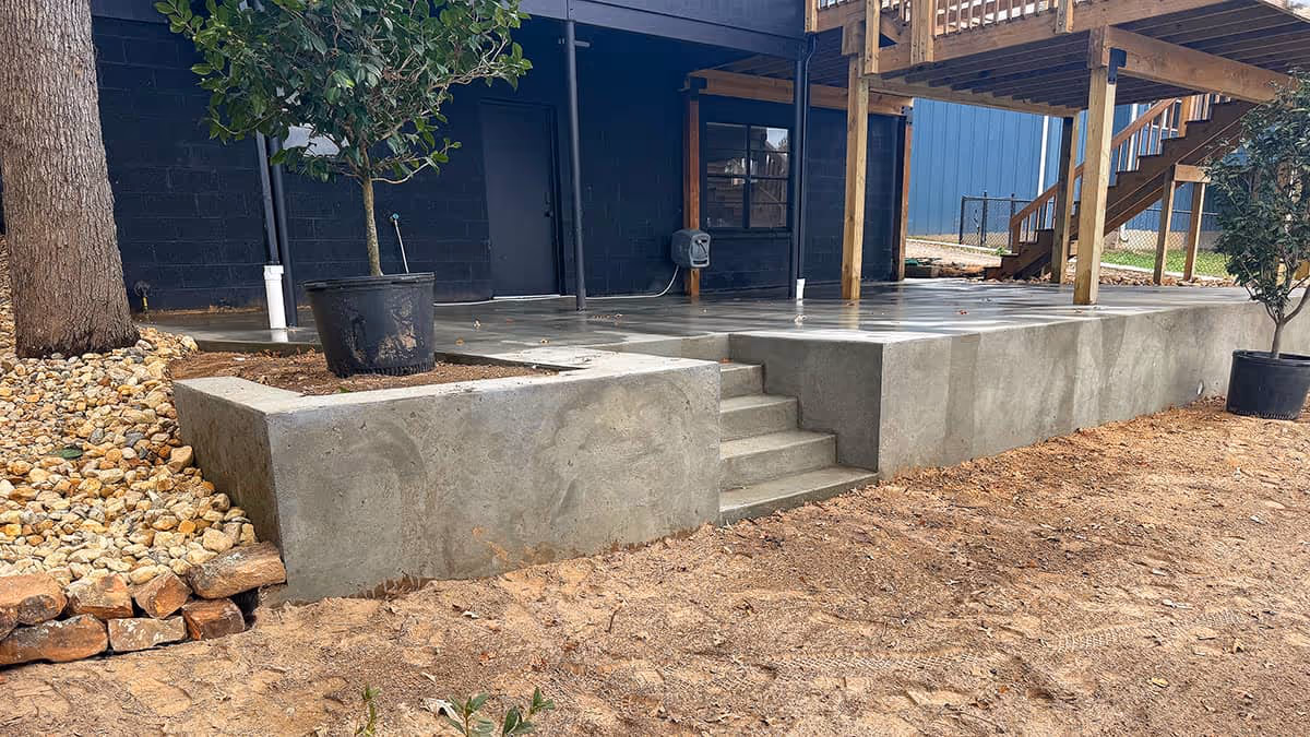 Photo of a lawn being watered by a sprinkler